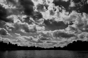 clouds_roll_over_in_black_and_white_by_bloomingvinedesign-d4gokek